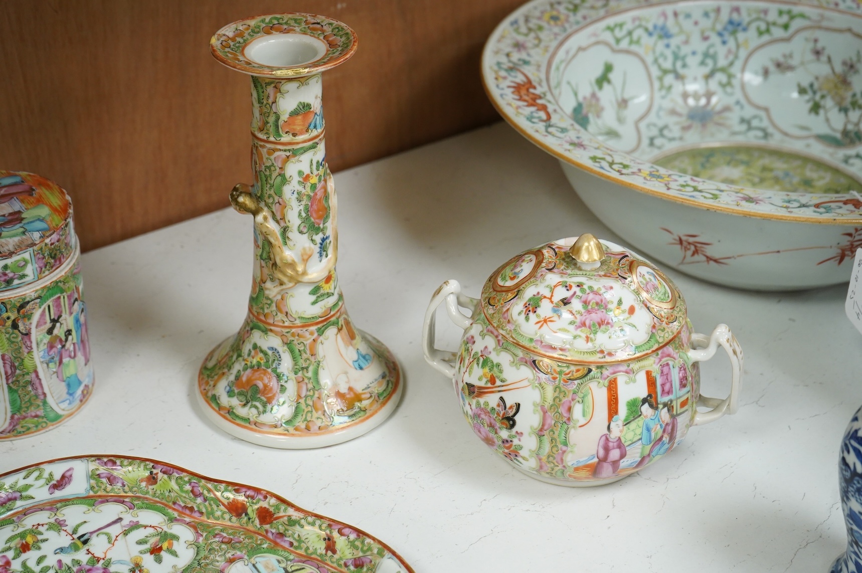 A collection of 19th century Chinese porcelain to include a pair of famille rose candlesticks, dish and a pair of blue and white baluster vases and covers